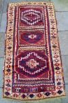  Antique CIHANBEYLI KURD Rug
Central Eastern Turkey / Circa 1875

Size: 3' x 6'4'' (approx.)
Condition / Description: I spent a fortune restoring this little rug, even though it doesn't have a lot of restoration. I discovered it in a small bazaar in a mosque courtyard in Istanbul and bought it because I wanted to preserve it. Well times have changed, and I might not make the same decision today, but i'm glad that I did at the time. One end border is restoration. There are small amounts of restoration to the field, and parts of the sides are restored, as well as the selvedges. I made no changes to the rug and it retains it's completely unique and original character. It doesn't lie flat, either, and I like it that way, (stretching hurts the texture and shine of the wool, but that is just my opinion). It has beautiful soft silky wool and an exceptional purple ground field color. Also has the lovely abrashes of apricot and orange that are common to the region and period. The weave is very fine for a village rug.

