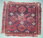  Baluch minakhani bagface ( khorjin ) with saturated color and interesting features for the structurally inclined including alternating bands of Turk:sh and Pers:an knots and a pronounced pattern of weft shifts as seen on the back.