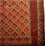  small Baluch rug or larger balisht with very glossy camel wool, Pers;anate ? pattern of repeat flowers and nice goat selvedges. Possibly an Arab piece? Good Age, floppy blanket-like handle and interesting weft shifts. apx. .5x1 m