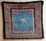  Tibetan meditation mat with single lotus flower on a fantastic sky blue background, rare, first half 19th C.