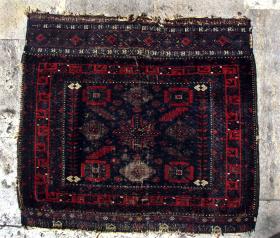   Baluch Mina Khani Bag Face, last quarter of the 19th century. This is one of the rarer pieces with animal figures, which appear in the k;l;m sections, both upper and lower. There is some wear, especially in the lower-middle gul, but otherwise the pile is in good condition.