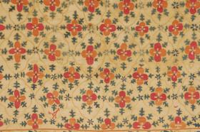 Small suzani.  Uzbekistan, early 19th century. Three joined cotton panels embroidered with beautifully shaded silk into a grid design of enclosed four leaf salmon and mauve flowers. Narrow border of meandering vine with blue flowers. 
The embroidery done with couching stitch and chain stitch. 33\
