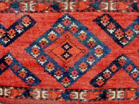  Turkmen Ersari Torba, ca 1900, with beautiful spacious design and bright, strong colors.  Full to medium pile with some areas of low pile. gouges in the upper corners and a one inch hole in the right lower corner of the field.  Complete with a plain k:l:m back.  17\