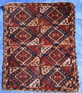  Central Asian, probably Uzbek, 19th century Bagface, slightly missing along the sides.  Full pile, symmetrically knotted, no holes, rips or repairs.  Gorgeous colors speak for themselves.
Size  2\'6\
