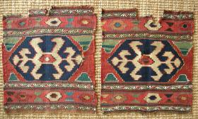 Pair of mafrash end panels, probably Kazak region, mixed technique � minor borders in sumak and the rest slit tapestry; colours all natural: 2 greens, 2 blues, peach, gold, ivory, brown and undyed cotton; 19th cent; 48 x 43 cms each; for analogy, see Azadi, Mafrash, p. 228; damaged as shown.
