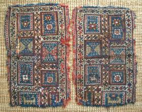 Swastikas, stars and dragons: Bakhtiari horse cover arms (pair of fragments), extra-weft wrapping on mostly blue warps and red wefts, undyed cotton highlighting, about 63 x 38 cms each.