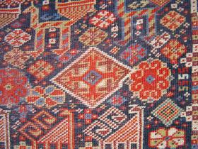  detail: Kashgai Main Carpet with Various Birds, Beasts and Geometrics. 173 x 234 cm. It\'s got wear but it\'s all there.