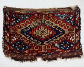  Unusual and interesting old Turkish bagface with a bold latch hooked field design, fair condition and very good natural colors. Mostly thick medium length pile, maybe a spot or two of slight wear. One good sized hole. Coarse weave. Sides rough, shallow gouges. Ends pretty good with some original flat weave.. All good old natural colors. High quality lustrous wool. 19th c. weaving. 20\
