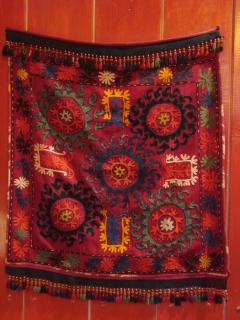Kyrgyz mirror cover.

Eccellent condition.
Handwoven wool.
Silk embroidery.
Backing silk ikat.
Early19th.
 
