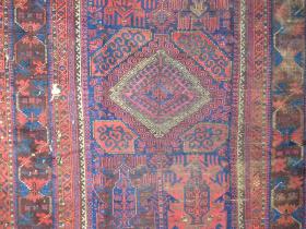  Baluch Timuri / Taimani main carpet with flame palmettes and a latch-hook medallion. Intact and very readable but not necessarily floor-worthy. Great flatwoven ends, most of the original goat selvedge and with a combination of elements in the field not often seen together.  285 x 163 cm( 112''x64'' inches )<br><p>I'll be in the San Francisco Bay area all summer. If you are in town and would like to see some rugs (some for sale and some not) please email me.