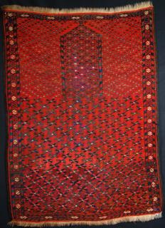  Ersari? Turkmen prayer rug, late 19th century. Complete but with some old re-piling to the field. Size: 3ft 9in x 2ft 10in.