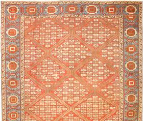 Antique Bakshaish Persian Carpet, (Bakhshaish or Bakhshaysh), late nineteenth century - 
8.11 x 10.11

Antique Bakshaishes with allover patterns are less common than ones with medallion compositions, but examples like this with a diagonal grid of fine geometric forms are rare indeed. This one has the design of a lovely little Caucasian expanded into monumental scale. The precise, crisp, angular drawing and warm coloration combine to make this carpet as decorative and delightful as it is unusual.