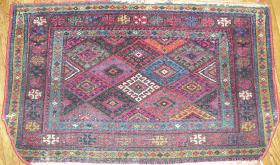  Jaff Kurd bagface which is probably not a Jaff Kurd bagface. This piece has an unusual weave which looks more like that of a Hamadan and an equally unusual color palette with prominent use of greens, purple and pink. 104x61cm (41\'\'x 24\'\' inches)  