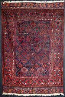  Baluch rug, 2nd half 19th century. Very fine weave, interesting field design & border. Complete kilims at both ends. Fair condition with some wear. Size: 4ft 10in x 3ft 3in.