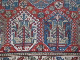 Fine old soumac rug approx 5' x 2'10''. Field colour abrashes to a browner tone at one end, there is some wear and fuchsine has been used. Very unusual design.
