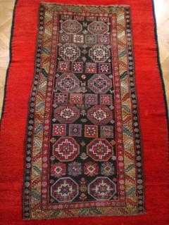Kurdish single wefted long rug circa 1890. Corroded brown field- could this be a Sauj Bulagh? All wool foundation, veggie dyes size approx 9' x 3'4''