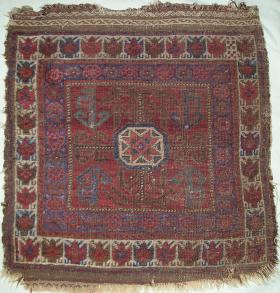  Baluch bagface with a white border made up of 'batty jabippy' [technical term] elements often found in older Yomud Turkmen weavings, especially in chuvals and ensis. Nice all natural color palette with a brick ground, blues and aqua greens. An uncommon authentic antique Baluchi weaving. 76x80cm(30''x31'' inches)