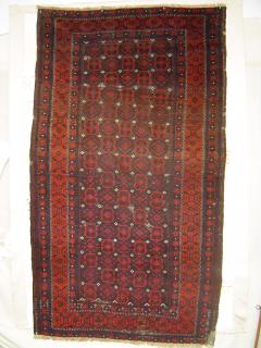 Antique Baluch Do-Gulli Carpet, 127 x 224 cm. Superb wool and color.(Chocolate aubergine purple.) Original side finish. Slight losses at ends. No restorations; small patches sewn on back to stabilize; lower right corner has darning. 