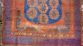 18th century Khotan rug.Worn but unrestored. 