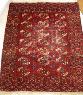 Nice small Tekke rug, end 19thc.Both elems are complete-on one side with closed kilim in best ivory wool -on the other with fringes.The damages have been caused by moths - else the pile is still in nearly in original height. All vegetable colors as: cherryred, orange, blue, light blue, strong yellow, white and natural brown. 