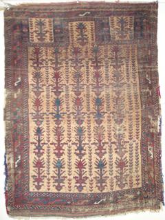  Sistan Baluch camel prayer rug with a tree palmette design more usually seen on Khorosan pieces. Unusually small mihrab flanked by two columns of botehs which is approximately the same size as the hand panels. Nice colors including a slightly corrosive green. A few inches of kilim ends on top and bottom but with some damage to the sides. (91x122 cm)