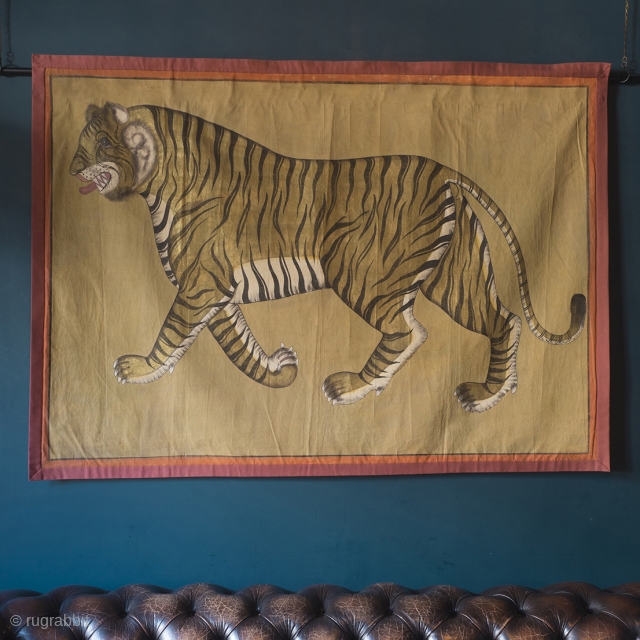 A highly decorative and very rare Indian Tiger painting. Gilt and oil pigments on cotton cloth.  150cm x 106cm (59 x 42 inches)

The painting is part of a tradition going back to  ...
