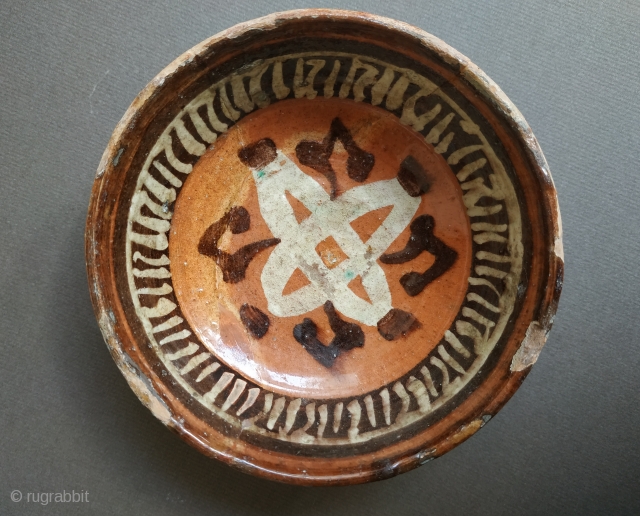 Samanid underglaze painted dish, of truncated conical form with a decoration formed by the Hebrew letter ם ‘Mem’ and a band of pseudo-kufic inscription, repaired clear breaks
Central Asia, Samarkand, early 11th century
H.  ...