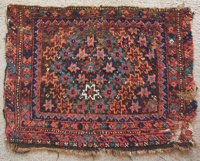Very rustic Baluch bagface. My guess is Sistan. Great soft wool and vibrant color. weft is varied with areas of cotton and camel colored wool. Size = 2'0"x1'7"     