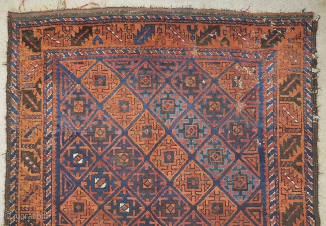 Baluch rug with serrated ashik-like tile design and a leaf border. Several blues, nice color in general. Goat hair side selvedge. 3'6"x6'3"           