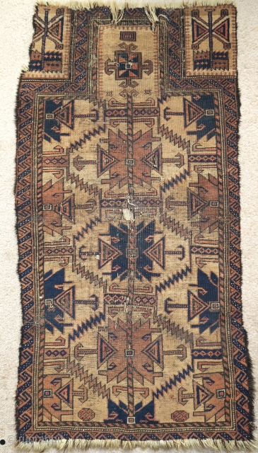 Baluch camel ground prayer rug with large ashik like design, black animal hair weft, tight thick weave, condition is quite messed up but the piece is still quite compelling.    