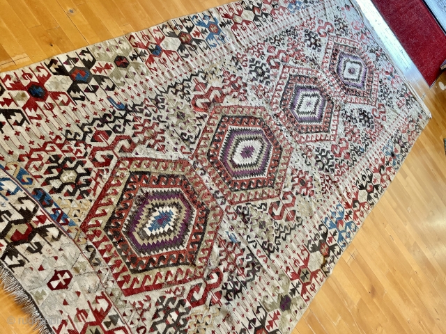 ANTIQUE 19 CENTURY , DOUBLE IVORY FIELD AND BORDER, LOTS OF AUBERGINE PURPLE, OXIDATIONS, ULTRA RARE ANATOLIAN KILIM FIND, ANCIENT RESTORATIONS, SIGNS OF USE, WALL HANGING LOOPS.


Minimalist Design


All Wool


All Organic colors



161 x  ...