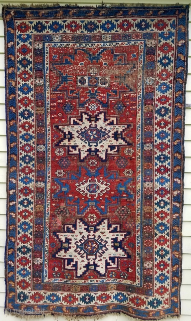 Leshgi star rug - about 6'9" x 4'.  Nicely executed drawing and color.  
Areas of wear with some old repiling (below right of 3rd star)and old securing of end braids.  ...