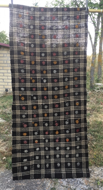 Goat hair kilim. Cm 113x243. Early to mid 20th century. Eastern Anatolia. Black & white checkered pattern with over hundred embroidered "guls". See description in here: http://rugrabbit.com/node/167998
      