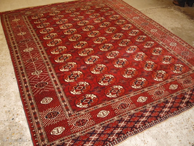 Antique Tekke Turkmen main carpet with 5 rows of 12 guls. www.knightsantiques.co.uk 
Size: 9ft 9in x 7ft 8in (298 x 234cm). 
Circa 1880.

A good Tekke main carpet of room size, the clear  ...