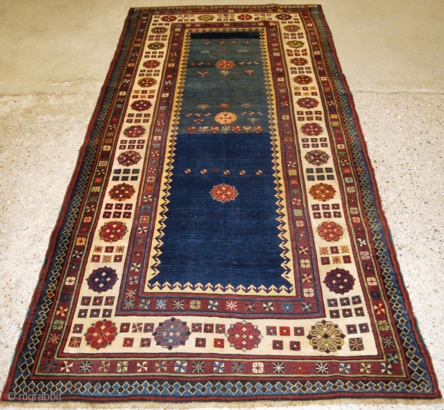 
Antique Caucasian Talish long rug with abrashed indigo blue field. www.knightsantiques.co.uk Size: 8ft 2in x 3ft 8in (250 x 113cm). 

Late 19th century.

The rug has a classic Talish design and border, the  ...