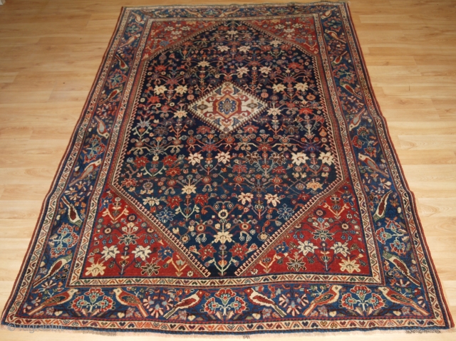 Antique South West Persian Kashkuli Qashqai rug with floral design. Note the unusual bird border. www.knightsantiques.co.uk Size: 7ft 7in x 4ft 9in (230 x 144cm). 

Circa 1900.

A very attractive rug by the  ...