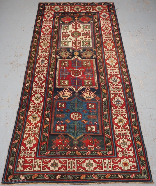 
Antique Caucasian Shirvan long rug from the Kuba region. www.knightsantiques.co.uk 

Circa 1890.
Size: 8ft 5in x 3ft 10in (257 x 117cm).
A good Kuba Shirvan rug with three linked medallions in ivory, madder red  ...