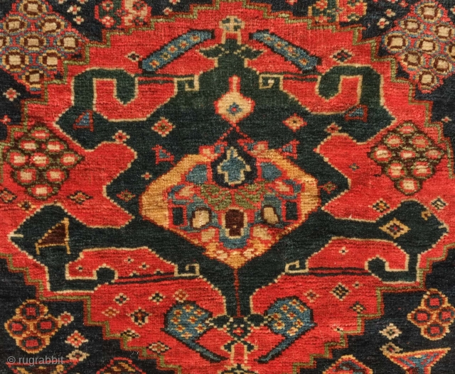 Qashqa'i saddle bag face, 19th century. Five to seven deeply saturated colors. Deep green in the central crab medallion with a slightly lighter shade in the top section.  More evident seen  ...