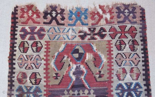 Prayer Kilim fragment....Central Anatolia ( Yesilova ? )...before 1825....professionally mounted on linen....frag size/ 2'4" x 4'2" (70cm x 130cm ) excellent patinated vegetal dyes....
condition as shown .      