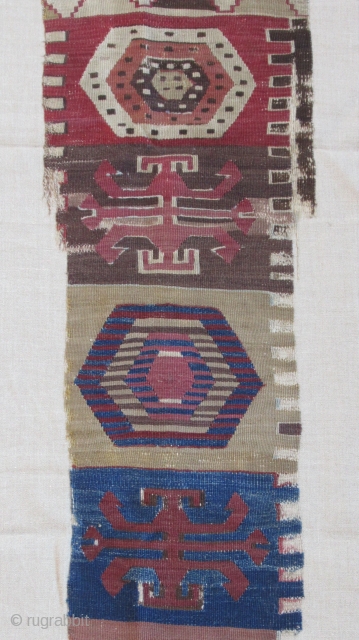 Anatolian kilim border fragment....Southeast Anatolia ( Reyhanli ? Kurdish ?) before 1825....wool w/ cotton-ground end-panel...very fine weave....frag. size 1'4" x 5"( 40 x 155 cm) ....unusual archaic motif drawings...professionally mounted on linen....condition  ...