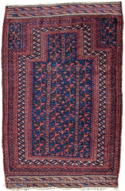 Late 19th - turn of the century, blue ground Baluch prayer rug. An old one with complete kilim ends. 2'10" x 4'4".           