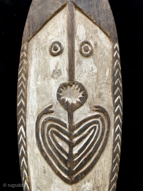 Papua New Guinea Spirit board (gope).  Size: 26 x 5.5 x 2 inches.  Wood plank carved in low relief.  Applied white lime with traces of red ochre remaining.
*Description that  ...
