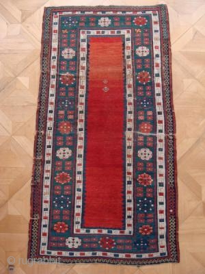 Such a beautiful rug. I believe it to be early nineteenth century. It has a fine weave with cotton wefts. 2.23m x 1.03m. Unrestored, some low areas and sides are missing. Now  ...
