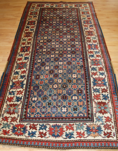 Antique Caucasian Gendje Kazak rug with star and lattice design. www.knightsantiques.co.uk 

Circa 1880.

Size: 7ft 11in x 4ft 0in (241 x 122cm).

This rug is an excellent example of Kazak weaving from the town  ...