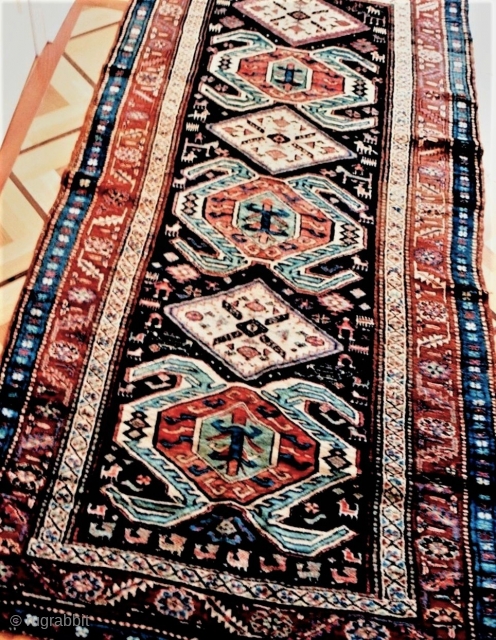 Great tribal character in this unusual Kurdish rug from the Transcaucasus with a Lenkoran-inspired pattern, last quarter 19c. Note the diverse range of village people and assorted creatures of many types. Long  ...