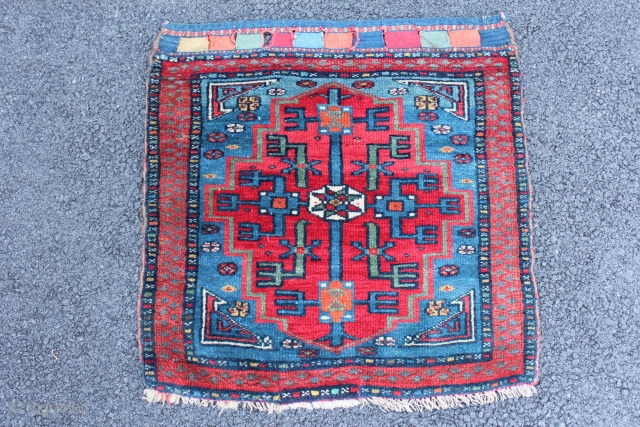Very fine Caucasian? bagface. Very finely woven with a very thin red weft. Great colors and bold graphic design. Size is 2' x 2'. One small reweaving at bottom. See picture with  ...
