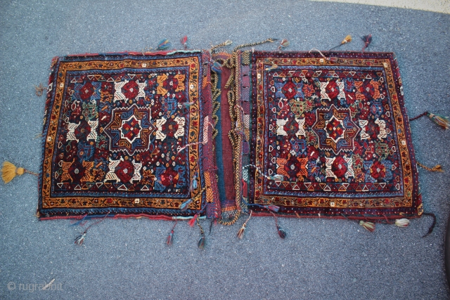 Complete large Khamseh bag set. Guessing first half of 20th century, maybe 30's. Measures 58 1/2" x 28". Each bag is 28x28. There are missing tassles and minor color run that came  ...