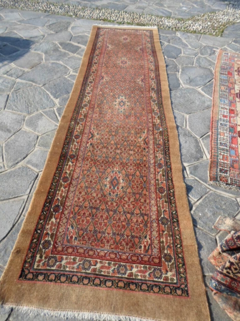 4 x 1 m. is the size of this antique Persian carpet khotted around 1900/1910 in
the region of serabend. Camel hair and beautiful color and very very good the
condition of this runner.  ...