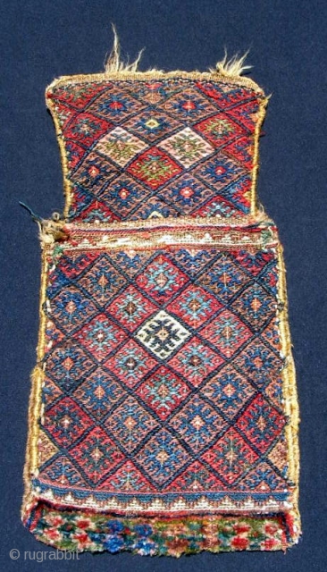 Kurdish (Jaff) salt bag, 13 



































Kurdish (Jaff) salt bag, 13 X 25".  Sumak face, piled bottom, flat woven back.  Good glowing natural dyes with good greens in sumak and pile.

















x  ...
