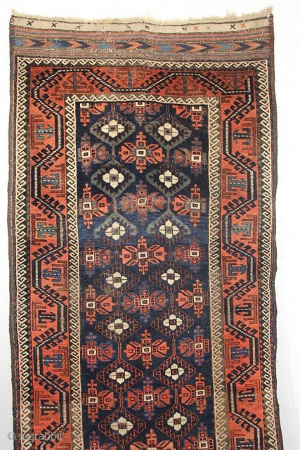 A Minakhani Baluch long rug, from Northeast Persia, Circa 1880 with beautiful abrash blue / green colors. measuring 3-2 x 9-2 feet.           